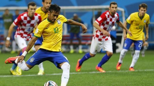Brazil's Neymar scores from a penalty kick during the 2014 World Cup opening match between Brazil and Croatia at the Corinthians arena in Sao Paulo June 12, 2014. REUTERS