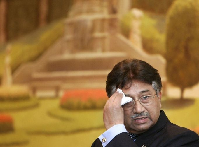 Pakistan's President Pervez Musharraf wipes his face while making a speech in Brussels January 21, 2008. Musharraf will seek support from the European Union and NATO on Monday at the start of a four-country trip to Europe where he is also expected to face tough questions over his rule. REUTERS/Yves Herman (BELGIUM)