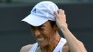 Francesca Schiavone of Italy reacts during her women's singles tennis match against Sabine Lisicki of Germany at the Wimbledon Tennis Championships, in London June 25, 20