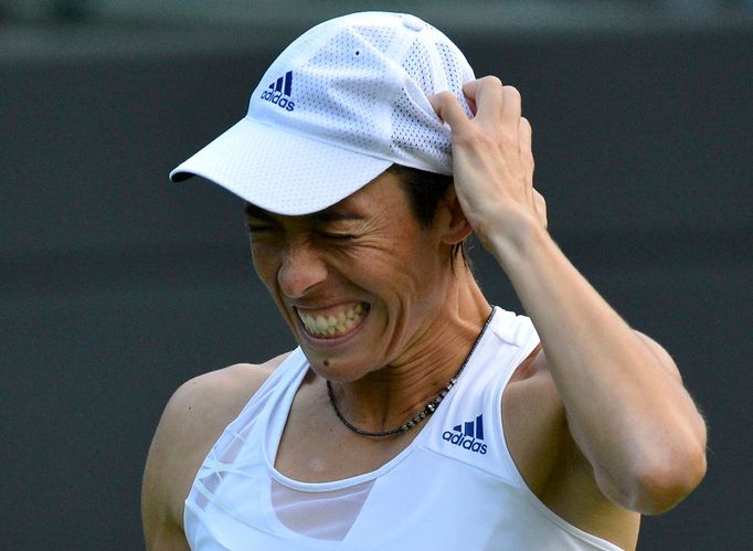 Francesca Schiavone of Italy reacts during her women's singles tennis match against Sabine Lisicki of Germany at the Wimbledon Tennis Championships, in London June 25, 20