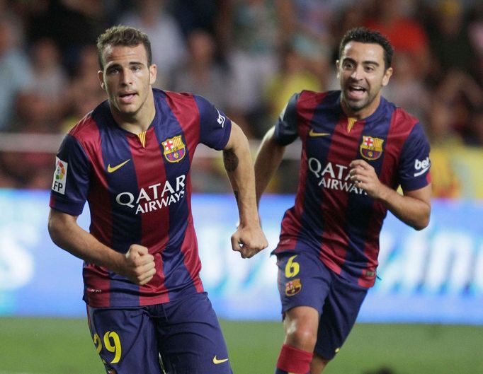 Barcelona's Sandro celebrates next to team mate Xavi after he scored against Villarreal during their Spanish first division soccer match at the Madrigal stadium in Villar