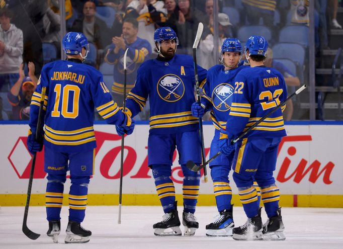 Sep 21, 2024; Buffalo, New York, USA;  Buffalo Sabres right wing JJ Peterka (77) celebrates his goal with teammates during the first period against the Pittsburgh Penguin