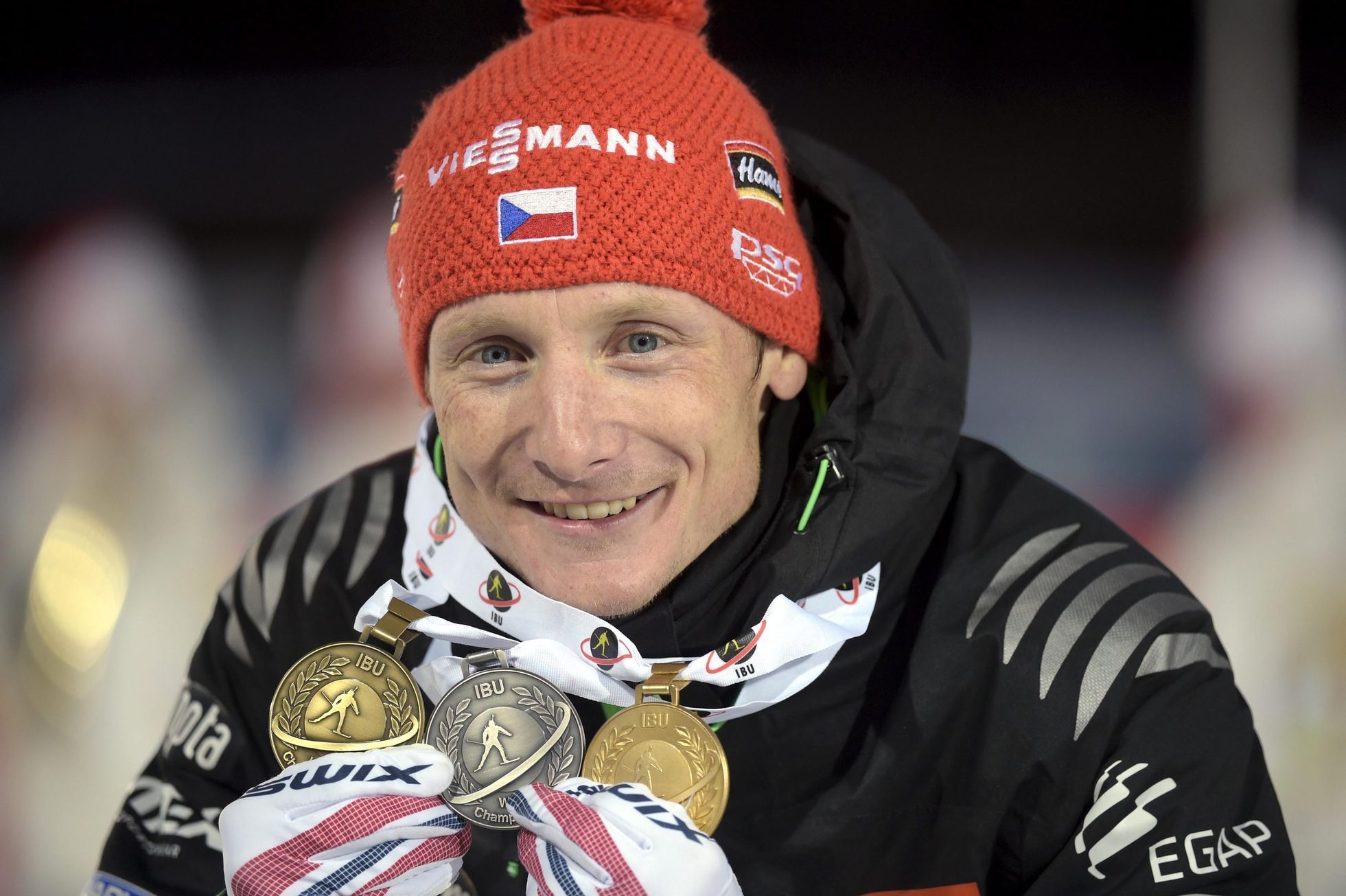 Czech Republic's Moravec poses with his medals at the IBU Biathlon World Championships in Kontiolahti