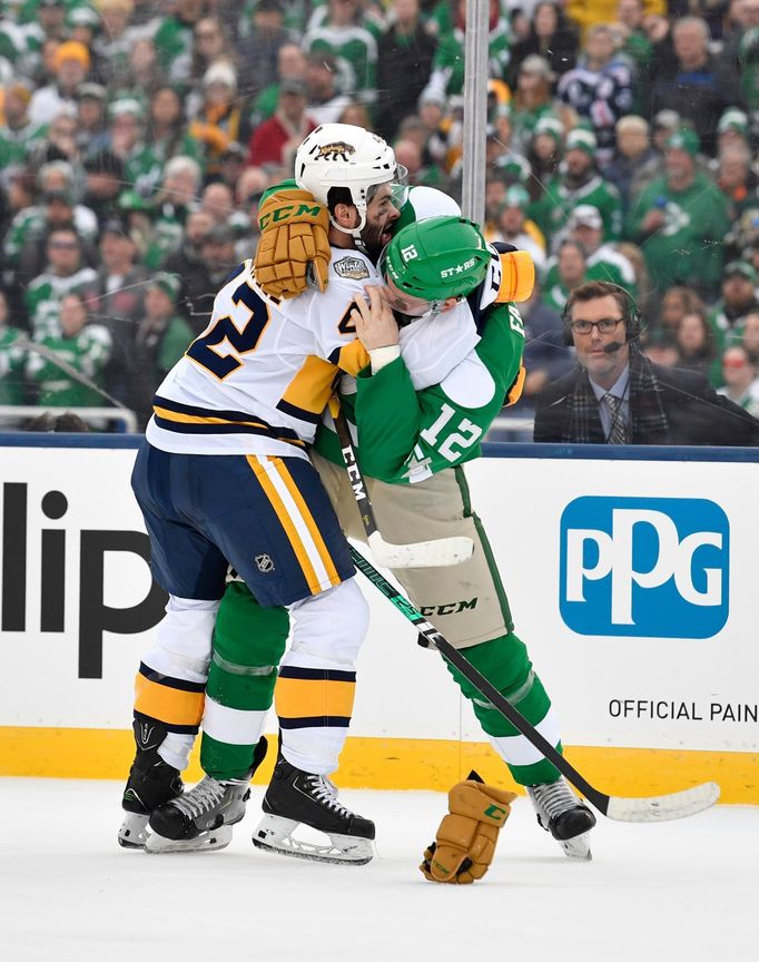 Jan 1, 2020; Dallas, TX, USA; Nashville Predators center Colin Blackwell (42) fights Dallas Stars center Radek Faksa (12) during the first period in the 2020 Winter Class