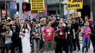 Comic Con attendees wait to cross the street to the Convention Center at the 2015 Comic-Con International in San Diego