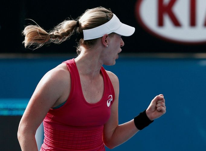 Alison Riske of the U.S. celebrates defeating Yanina Wickmayer of Belgium during their women's singles match at the Australian Open 2014 tennis tournament in Melbourne Ja