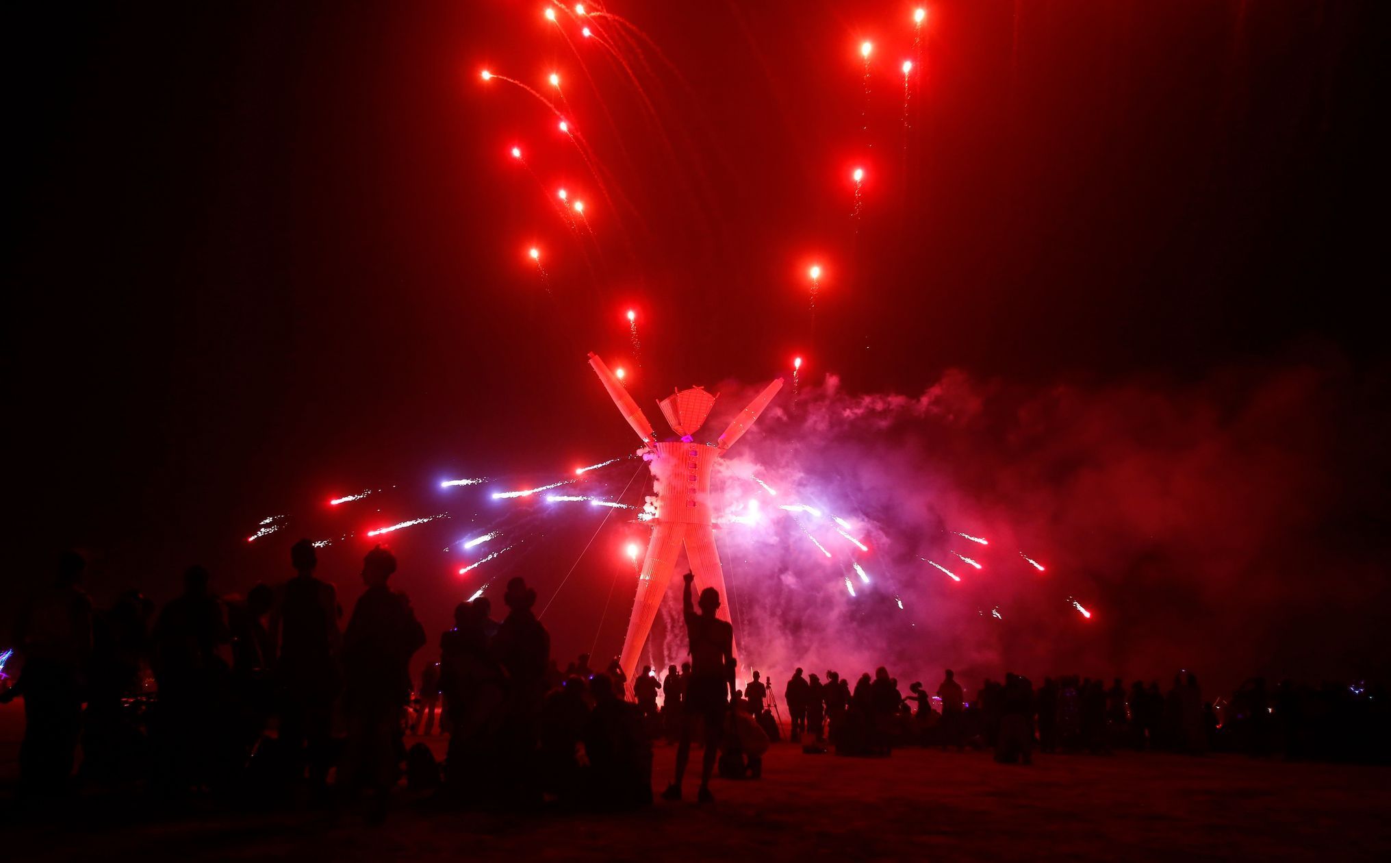 Fireworks are seen before the Man burns during the Burning Man 2014 &quot;Caravansary&quot; arts and music festival in the Black Rock Desert of Nevada
