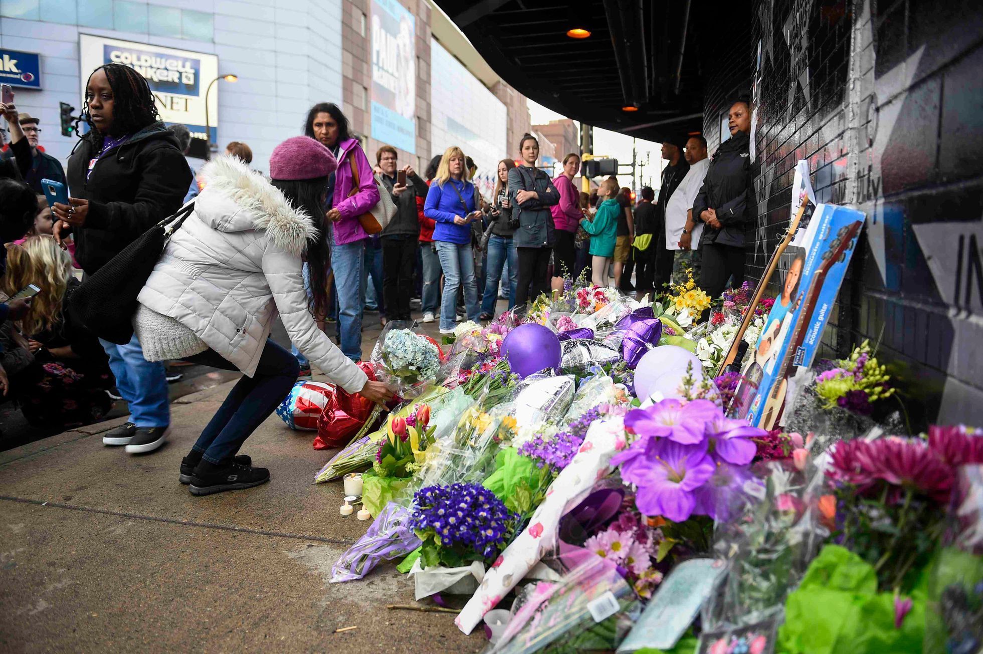 Fans lay flowers and memorials outside First Avenue the nightclub where U.S. music superstar Prince got his start in Minneapolis Minnesota