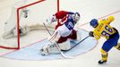 Sweden's Linus Klasen (R) scores against goaltender Alexander Salak of the Czech Republic (L) during a penalty shoot out during their men's ice hockey World Championship