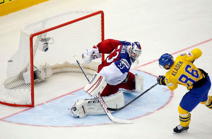 Sweden's Linus Klasen (R) scores against goaltender Alexander Salak of the Czech Republic (L) during a penalty shoot out during their men's ice hockey World Championship