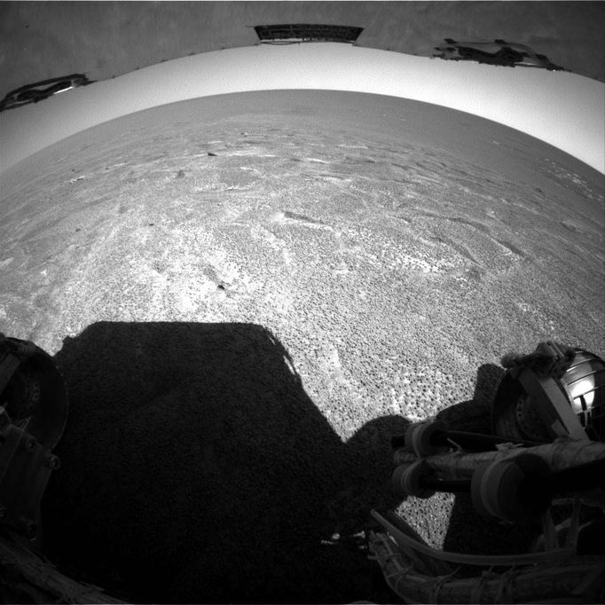 Out of 'Endurance,' Heading South 12/13/04 NASA's Mars Exploration Rover Opportunity climbed out of "Endurance Crater" during the rover's 315th sol (Dec. 12, 2004), and used its rear hazard-avoidance camera to look out across the plains south of the crater. After Opportunity examines the nearby heat shield that protected it during its descent through Mars' atmosphere, the rover team plans to drive the rover south to a rugged region described as etched terrain. Image Credit: NASA/JPL