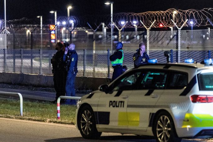FILE PHOTO: Police officers stand guard after all traffic has been closed at the Copenhagen Airport due to drone reports in Copenhagen, Denmark September 22, 2025. Ritzau