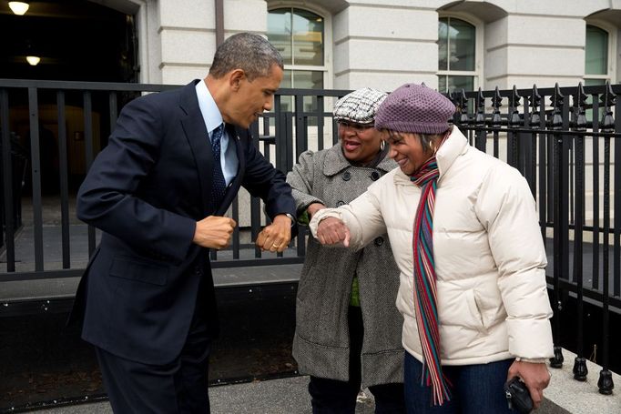 Dec. 31, 2012 "Following remarks in the Eisenhower Executive Office Building on the fiscal cliff negotiations, the President greets a couple of OMB workers as he walked back across on West Executive Avenue as he walked back to the West Wing of the White House. He gave them an elbow-bump, because he had just put Purell on his hands