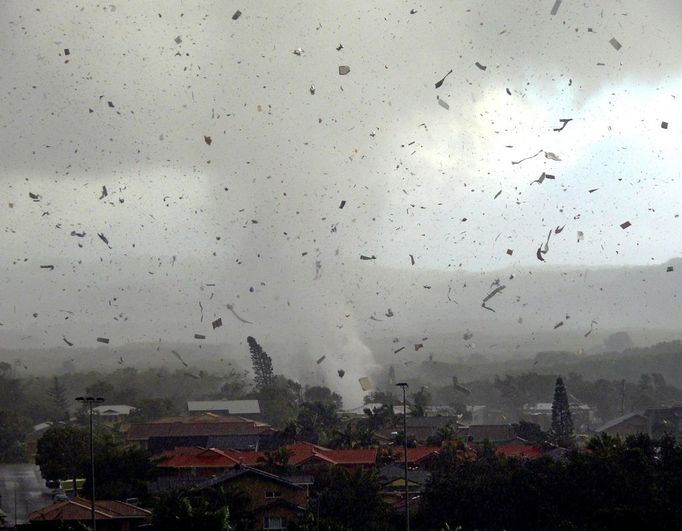 Debris flies through the air as a freak tornado tears through the coastal town of Lennox Head on June 3, 2010. The storm levelled 12 homes and damaged another 30, with twisting winds carving out a 300 metre-wide path of destruction, injuring six people and leaving thousands without power.