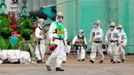 Workers walk near the No.4 reactor of the Tokyo Electric Power Co (TEPCO)'s tsunami-crippled Fukushima Daiichi nuclear power plant in Fukushima prefecture, in this photo released by Kyodo March 1, 2013, ahead of the second-year anniversary of the March 11, 2011 earthquake and tsunami. Mandatory Credit REUTERS/Kyodo (JAPAN - Tags: DISASTER ANNIVERSARY BUSINESS) ATTENTION EDITORS -THIS IMAGE HAS BEEN SUPPLIED BY A THIRD PARTY. IT IS DISTRIBUTED, EXACTLY AS RECEIVED BY REUTERS, AS A SERVICE TO CLIENTS. FOR EDITORIAL USE ONLY. NOT FOR SALE FOR MARKETING OR ADVERTISING CAMPAIGNS. MANDATORY CREDIT. JAPAN OUT. NO COMMERCIAL OR EDITORIAL SALES IN JAPAN. YES Published: Bře. 1, 2013, 2:16 odp.