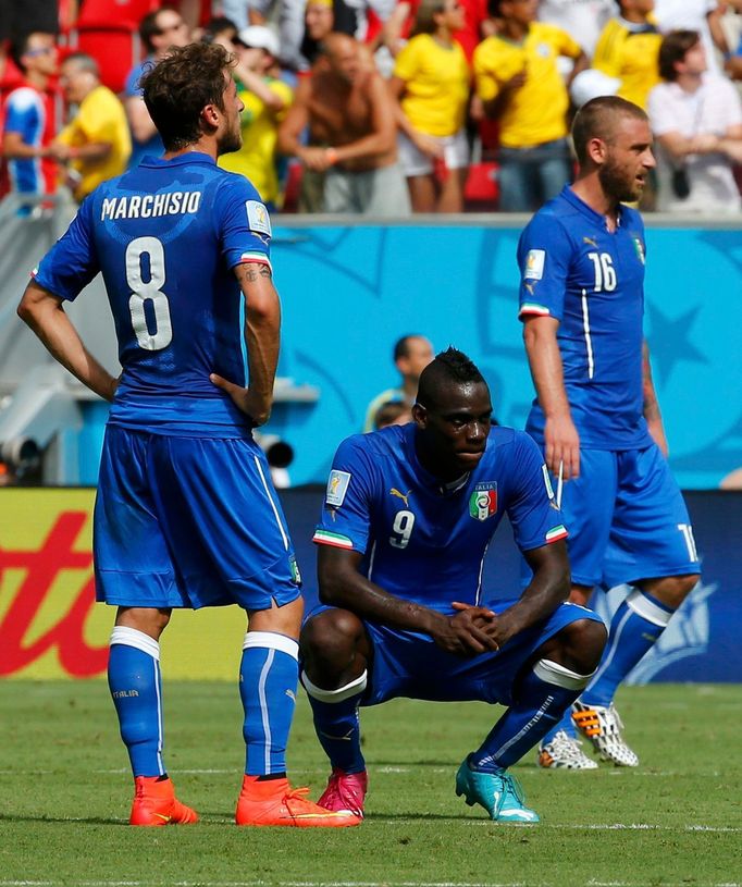 Italy's Claudio Marchisio, Balotelli and De Rossi react after a goal by Costa Rica's Bryan Ruiz during World Cup Group D soccer match at the Pernambuco arena