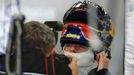 Toro Rosso Formula One driver Max Verstappen of the Netherlands ust on his helmet in the team garage during the third practice session of the Australian F1 Grand Prix at