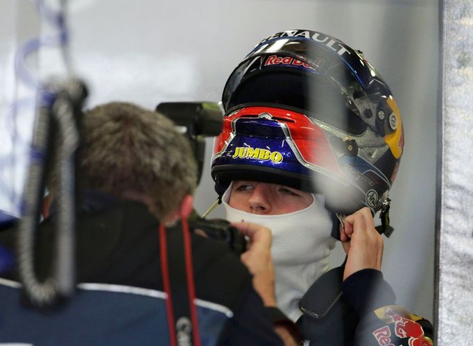 Toro Rosso Formula One driver Max Verstappen of the Netherlands ust on his helmet in the team garage during the third practice session of the Australian F1 Grand Prix at