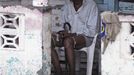 A man sits in his porch flooded by rain from Tropical Storm Isaac in Jaquimeyes, Barahona province, August 25, 2012. Tropical Storm Isaac emerged over warm Caribbean waters on Saturday slightly weaker but ready to regroup after dumping torrential rains on the Dominican Republic and Haiti. REUTERS/Ricardo Rojas (DOMINICAN REPUBLIC - Tags: DISASTER ENVIRONMENT) Published: Srp. 25, 2012, 4:51 odp.