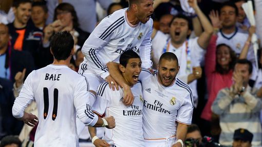 Real Madrid's Angel Di Maria celebrates a goal with his teammates Karim Benzema Gareth Bale and Sergio Ramos during their King's Cup final soccer match against Barcelona