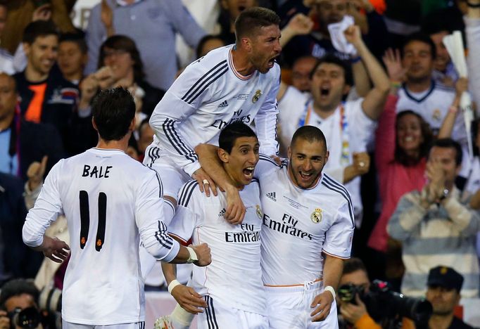 Real Madrid's Angel Di Maria celebrates a goal with his teammates Karim Benzema Gareth Bale and Sergio Ramos during their King's Cup final soccer match against Barcelona