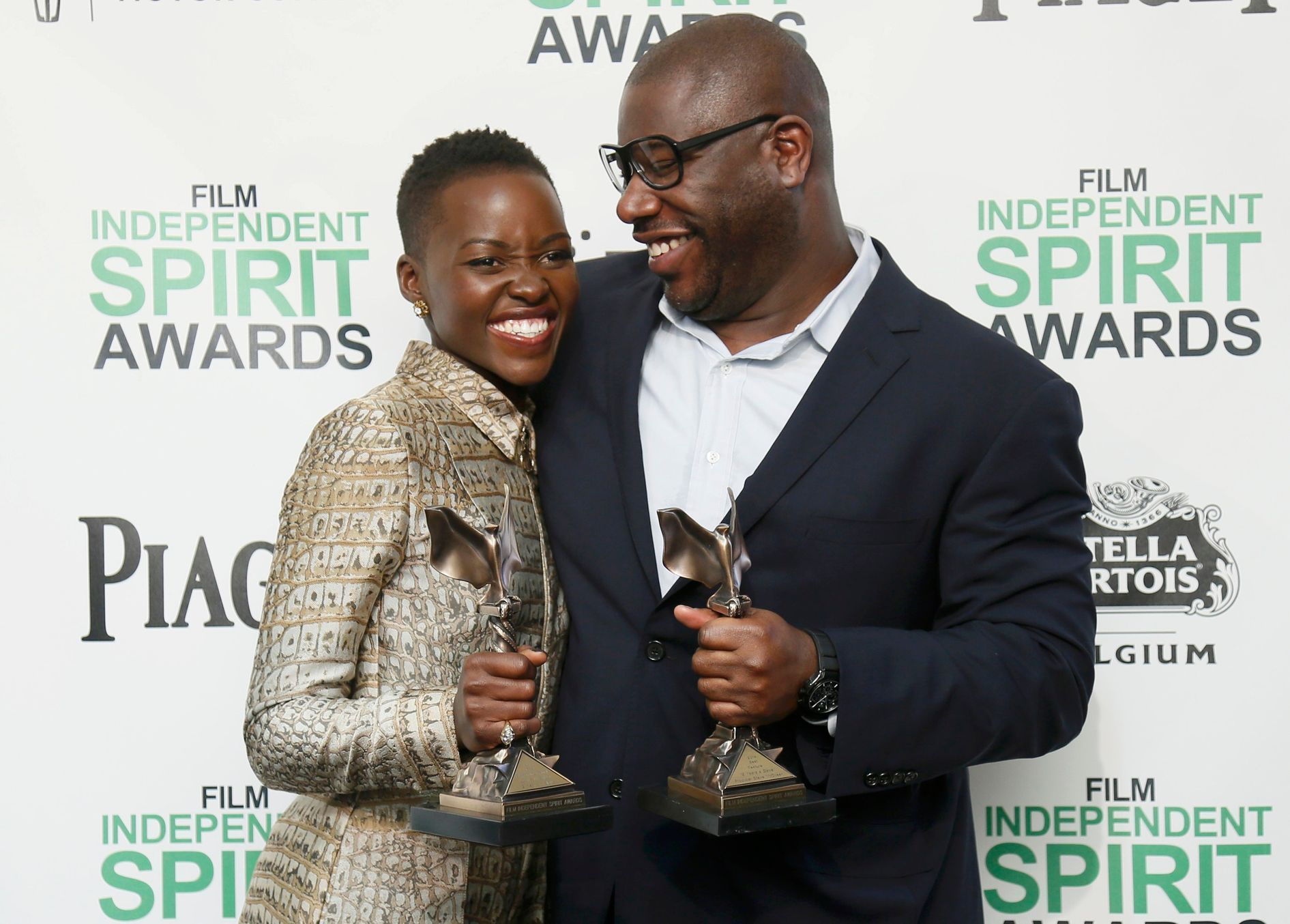 Actress Nyong'o and director McQueen pose with their awards for &quot;12 Years a Slave&quot; backstage at the 2014 Film Independent Spirit Awards in Santa Monica