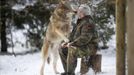 Mongolian wolf Heiko licks the mouth of wolf researcher Werner Freund in a sign of acknowledgement at Wolfspark Werner Freund, in Merzig in the German province of Saarland January 24, 2013. Freund, 79, a former German paratrooper, established the wolf sanctuary in 1972 and has raised more than 70 animals over the last 40 years. The wolves, acquired as cubs from zoos or animal parks, were mostly hand-reared. Spread over 25 acres, Wolfspark is currently home to 29 wolves forming six packs from European, Siberian, Canadian, Artic and Mongolian regions. Werner has to behave as the wolf alpha male of the pack to earn the other wolves respect and to be accepted. Picture taken January 24, 2013. REUTERS/Lisi Niesner (GERMANY - Tags: ANIMALS SOCIETY) Published: Led. 26, 2013, 2:43 odp.