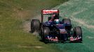 Toro Rosso Formula One driver Jean-Eric Vergne of France drives on the grass during the first practice session of the Australian F1 Grand Prix at the Albert Park circuit