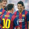 FC Barcelona's player Suarez smiles to teammate Messi during their team presentation at Nou Camp stadium in Barcelona