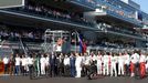 Formula One drivers and officials pray for Marussia Formula One driver Jules Bianchi of France who had an accident in the previous race, before the first Russian Grand Pr