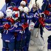 France's players celebrate after their men's ice hockey World Championship Group A game against Canada at Chizhovka Arena in Minsk