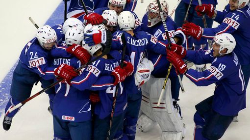 France's players celebrate after their men's ice hockey World Championship Group A game against Canada at Chizhovka Arena in Minsk May 9, 2014. Reuters/Vasily Fedosenko (