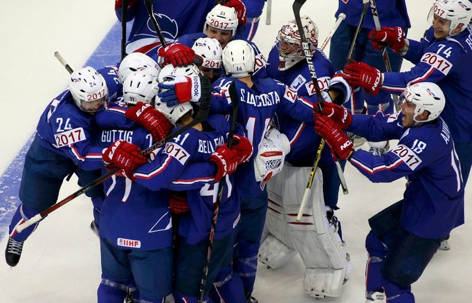 France's players celebrate after their men's ice hockey World Championship Group A game against Canada at Chizhovka Arena in Minsk May 9, 2014. Reuters/Vasily Fedosenko (