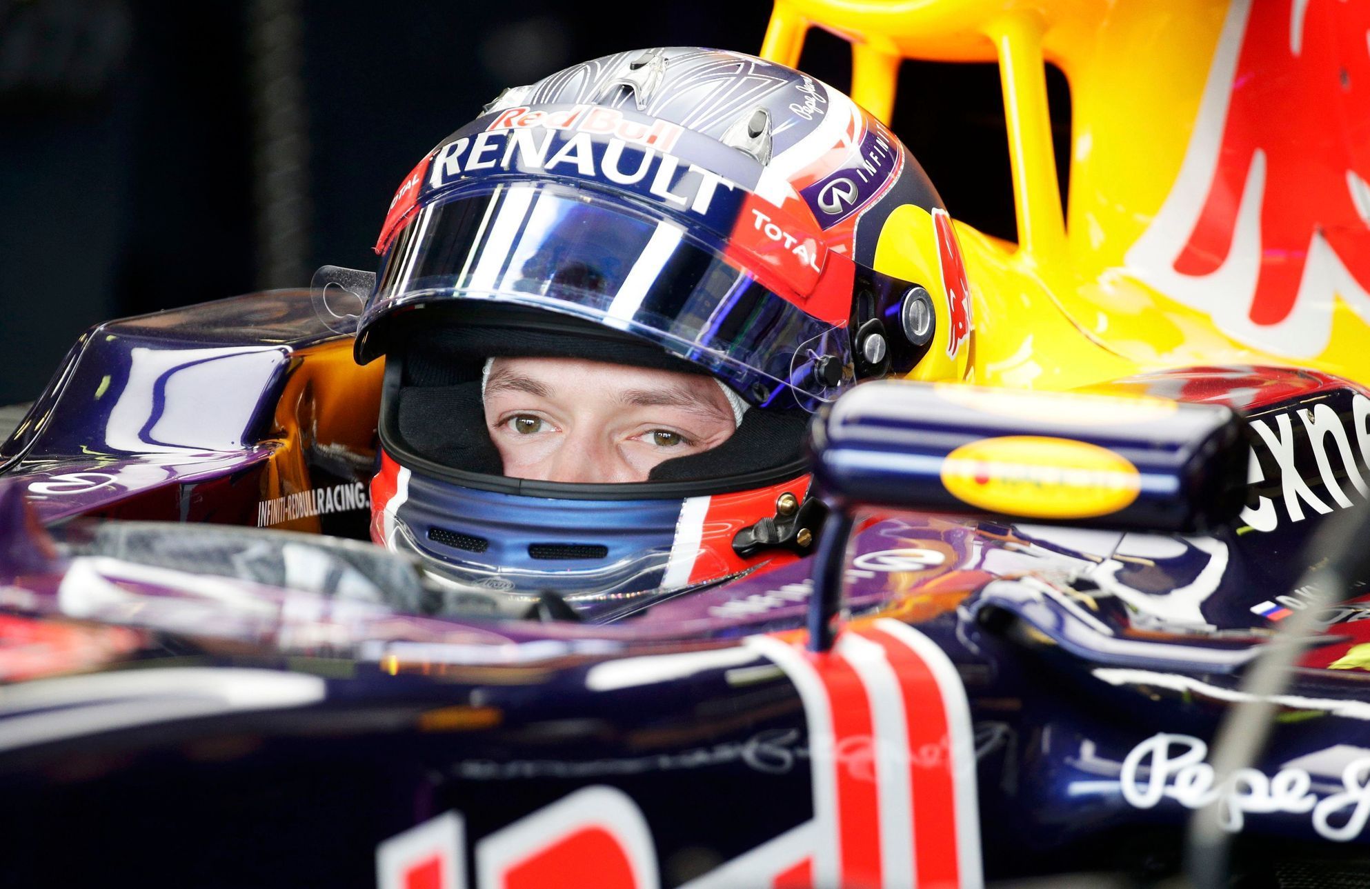 Red Bull Formula One driver Daniil Kvyat of Russia sits in his car in the team garage during the third practice session of the Australian F1 Grand Prix at the Albert Park circuit in Melbourne