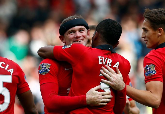 Manchester United's Wayne Rooney celebrates scoring a goal with teammates during their English Premier League soccer match against Crystal Palace at Old Trafford in Manch