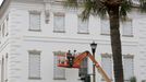 Workers cover the windows of the historic Charleston County Courthouse in Charleston, S.C., in preparation for the advancing Hurricane Florence.