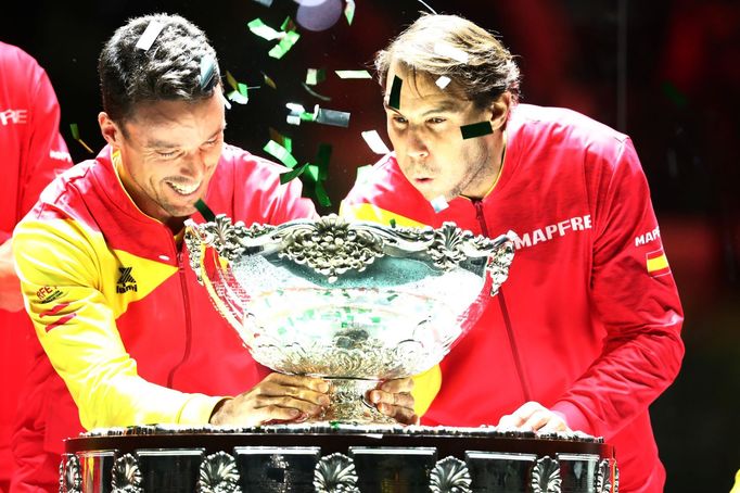 Tennis - Davis Cup Finals - Final - Caja Magica, Madrid, Spain - November 24, 2019   Spain's Rafael Nadal celebrates with the trophy and team mates after winning the Davi