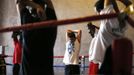 Unemployed Belgian Mohamed Sammar stretches as he takes part in a "Fit for a job" boxing class in Brussels June 14, 2013. Sammar, 27, has been looking for a job in the construction sector for 2 years. "Fit for a job" is the initiative of former Belgian boxing champion Bea Diallo, whose goal was to restore the confidence of unemployed people and help them find a job through their participation in sports. Picture taken June 14, 2013. REUTERS/Francois Lenoir (BELGIUM - Tags: SPORT BOXING SOCIETY BUSINESS EMPLOYMENT) Published: Čec. 5, 2013, 3:57 odp.