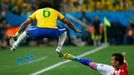 Brazil's Marcelo (L) jumps as Croatia's Ivan Perisic slides beside him during their 2014 World Cup opening match at the Corinthians arena in Sao Paulo June 12, 2014. REUT