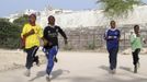 Somali athletes run inside the Koonis stadium as they train during preparations for the 2012 London Olympic Games in Somalia's capital Mogadishu in this March 14, 2012 file photo. Training in a bullet-riddled stadium where the remains of a rocket propelled grenade lies discarded on the track's edge counts as progress for Somali Olympic hopeful Mohamed Hassan Mohamed. A year ago, Mogadishu's Konis stadium was a base for Islamist militants and a work out meant at times running through the streets, dodging gun-fire and mortar shells in one of the world's most dangerous cities. Picture taken March 14, 2012. To match OLY-SOMALIA-HOPES/ REUTERS/Feisal Omar/Files (SOMALIA - Tags: SPORT ATHLETICS SOCIETY OLYMPICS) Published: Čer. 11, 2012, 7:11 dop.