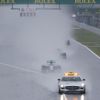 Mercedes Formula One driver Rosberg of Germany leads team mate Hamilton of Britain behind a safety car as they start the first lap of the rain-affected Japanese F1 Grand Prix at the Suzuka Circuit