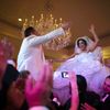 Moshar, who is of Persian, German and Filipino descent, dances with her husband Safar, whose parents are from Syria, as they are both lifted into the air during their wedding reception in Pasadena