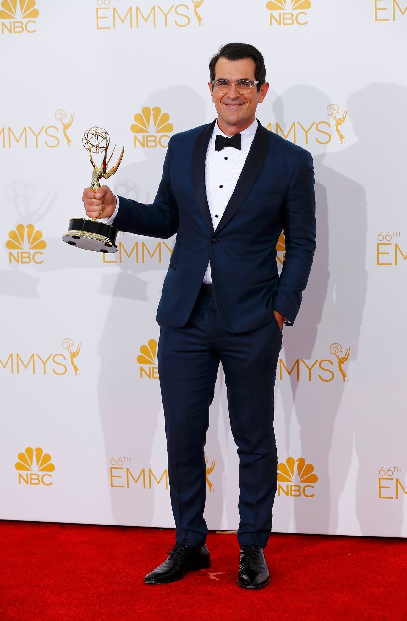Ty Burrell poses with his Outstanding Supporting Actor in a Comedy Series award for the ABC sitcom &quot;Modern Family&quot; at the 66th Primetime Emmy Awards in Los Angeles