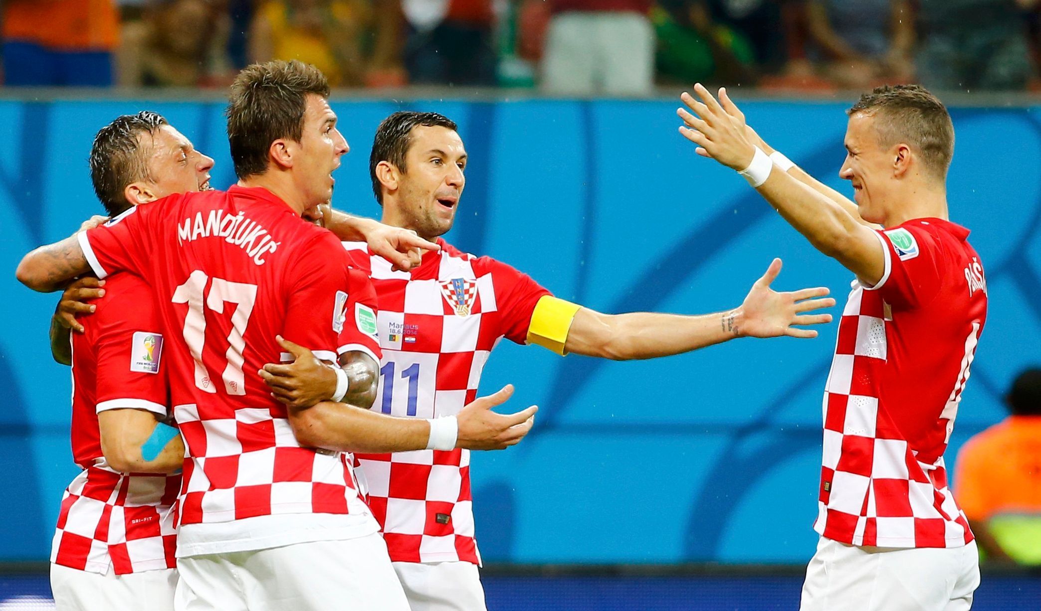 Croatia's Olic celebrates his goal against Cameroon with his teammates during their 2014 World Cup Group A soccer match at the Amazonia arena in Manaus