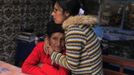 Marathon runner Gladys Tejeda (R), the first Peruvian athlete who qualified for the 2012 London Olympic Games, embraces her mother Marcelina Pucuhuaranga at her home in the Andean province of Junin May 13, 2012. A private company will take Pucuhuaranga, 69, to London as part of the "Thank you Mom" program. For Pucuhuaranga, who received her first passport, it will be the first time travelling out of Peru. The program will take about 120 mothers of different athletes around the world to attend the games. Tejeda, the youngest of nine children, returned to her hometown to visit her mother and to focus on training where she will run more than 20 km every day in the highlands (over 4,105 meters above sea level). Picture taken May 13, 2012. REUTERS/Pilar Olivares(PERU - Tags: SPORT ATHLETICS OLYMPICS) Published: Kvě. 17, 2012, 5:58 odp.