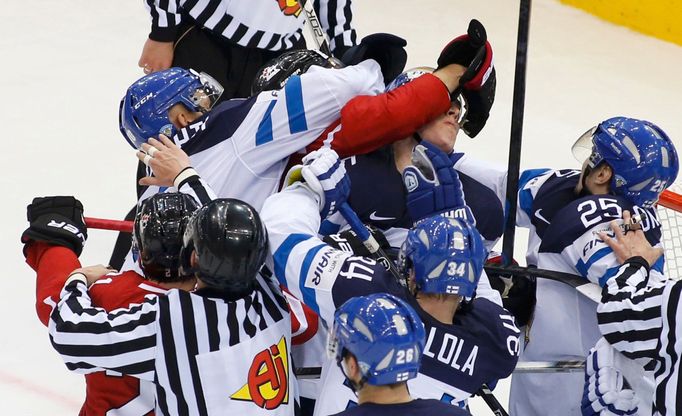 Finland and Canada players fight during during the second period of their men's ice hockey World Championship quarter-final game at Chizhovka Arena in Minsk May 22, 2014.