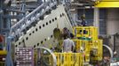 Cessna employees work on a tail section during a tour of the Cessna business jet assembly line at their manufacturing plant in Wichita, Kansas August 14, 2012. One of Cessna Aircraft Company CEO and president Scott Ernes' first moves after joining in May 2011 was to carve Cessna up into five units, each of which run by an executive who was responsible for whether the unit reported a profit or loss. Picture taken August 14, 2012. REUTERS/Jeff Tuttle (UNITED STATES - Tags: TRANSPORT BUSINESS) Published: Srp. 22, 2012, 11:40 dop.