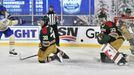 David Perron (57) takes a shot against Minnesota Wild right wing Ryan Hartman (38)