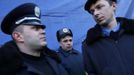 Police officers from Lviv who have arrived to join anti-government protesters appear on a stage in Independence Square in Kiev February 21, 2014.