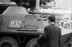 A face to face encounter. A powerless human being facing the heavy machinery.